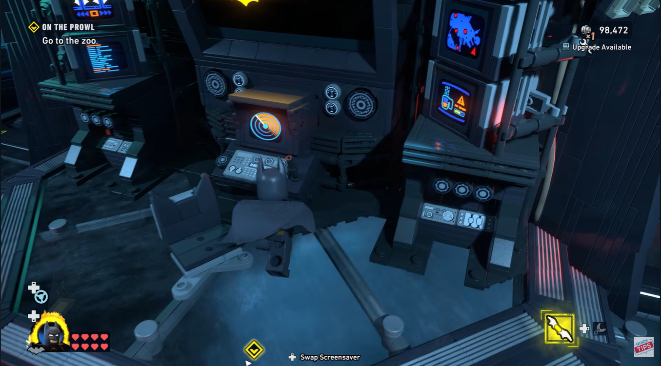 batman approaching batcomputer in Batcave.