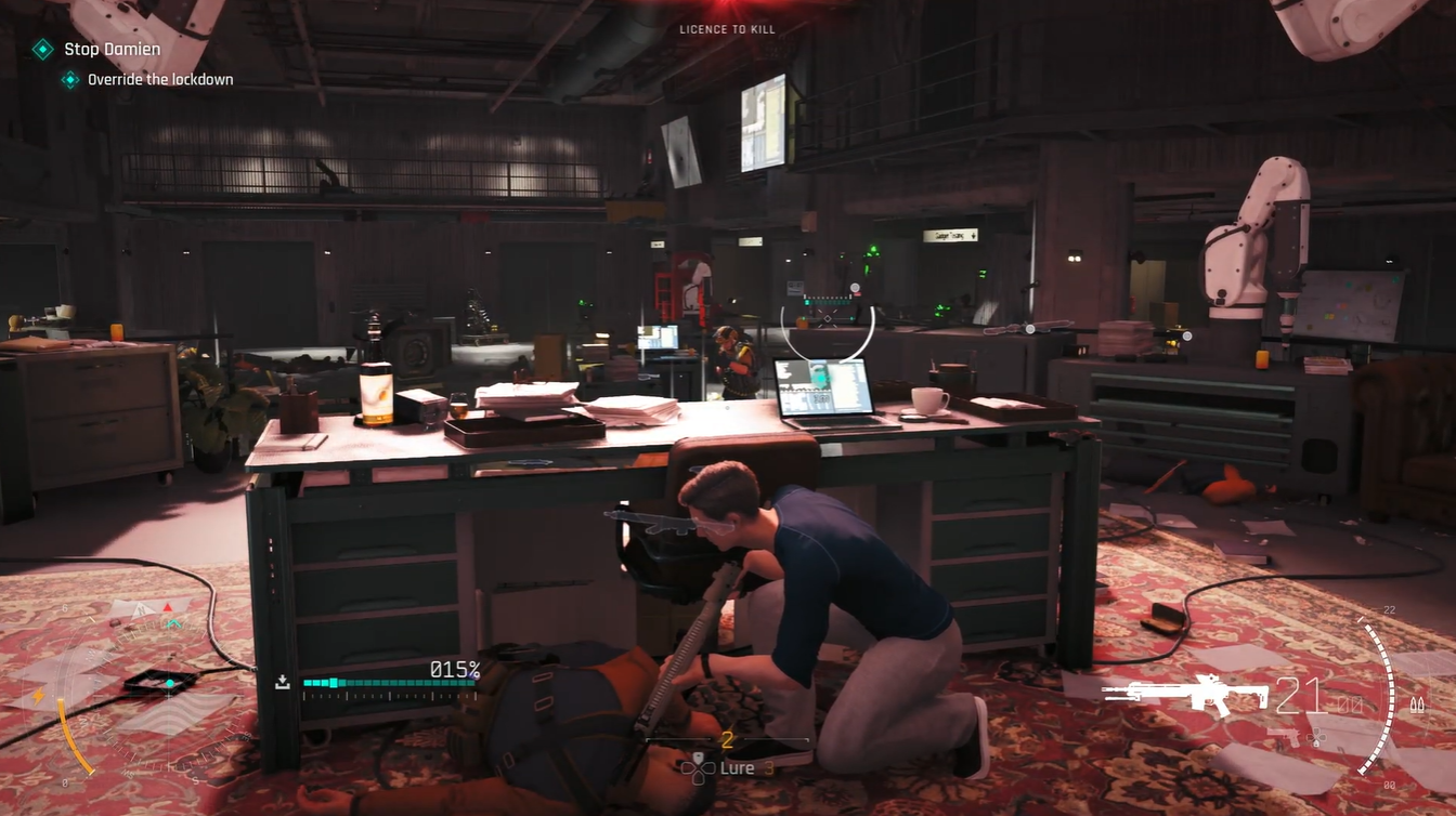 Player interacting with the lockdown override laptop terminal to begin the upload sequence in 007 First Light.
