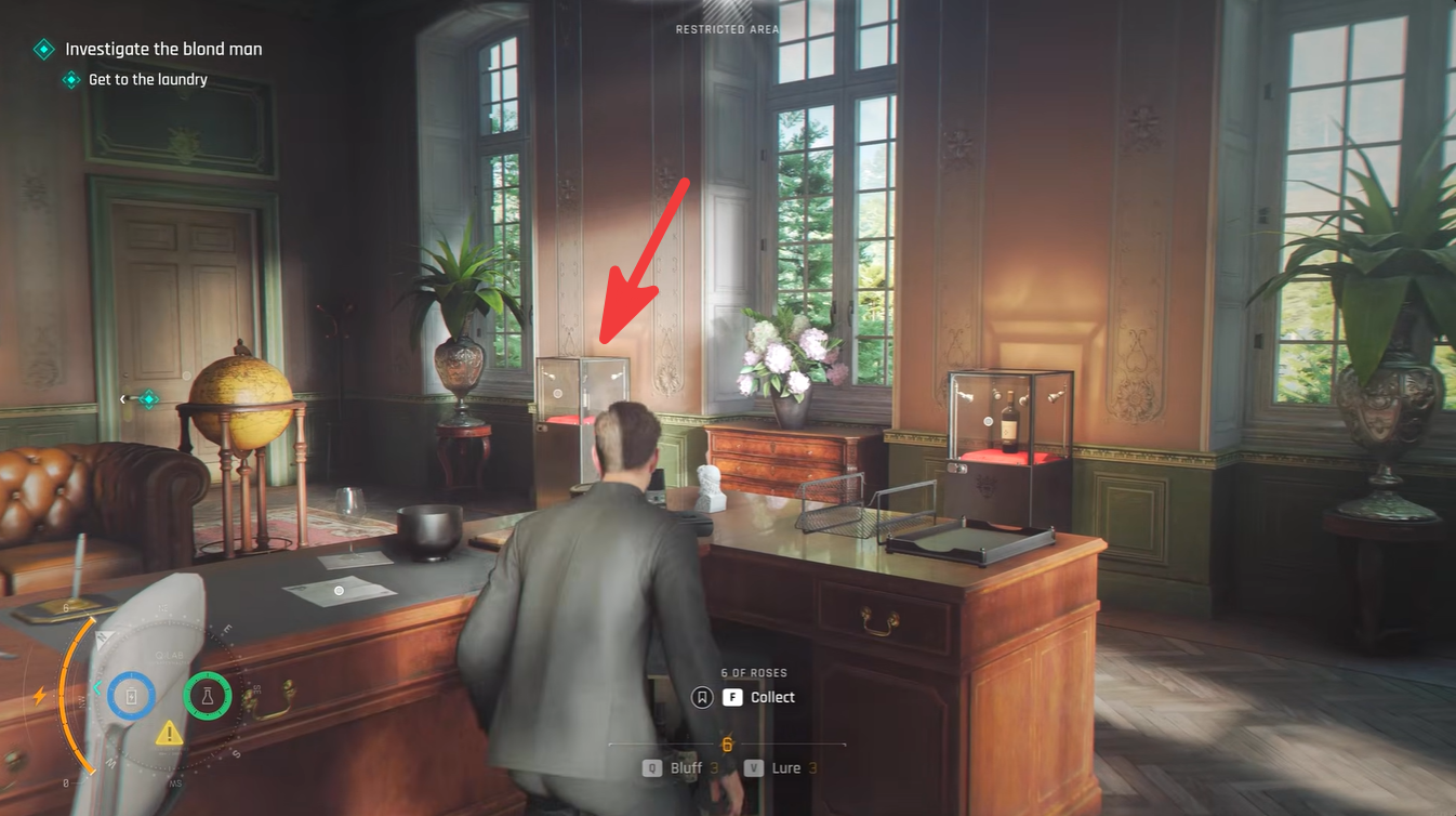 Wine bottle display case showing the hidden safe code clue in the Manager’s Office