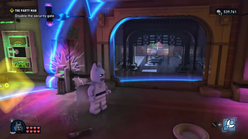 Second boombox collectible hidden underneath the staircase after opening the secret gate in LEGO Batman Party Man.