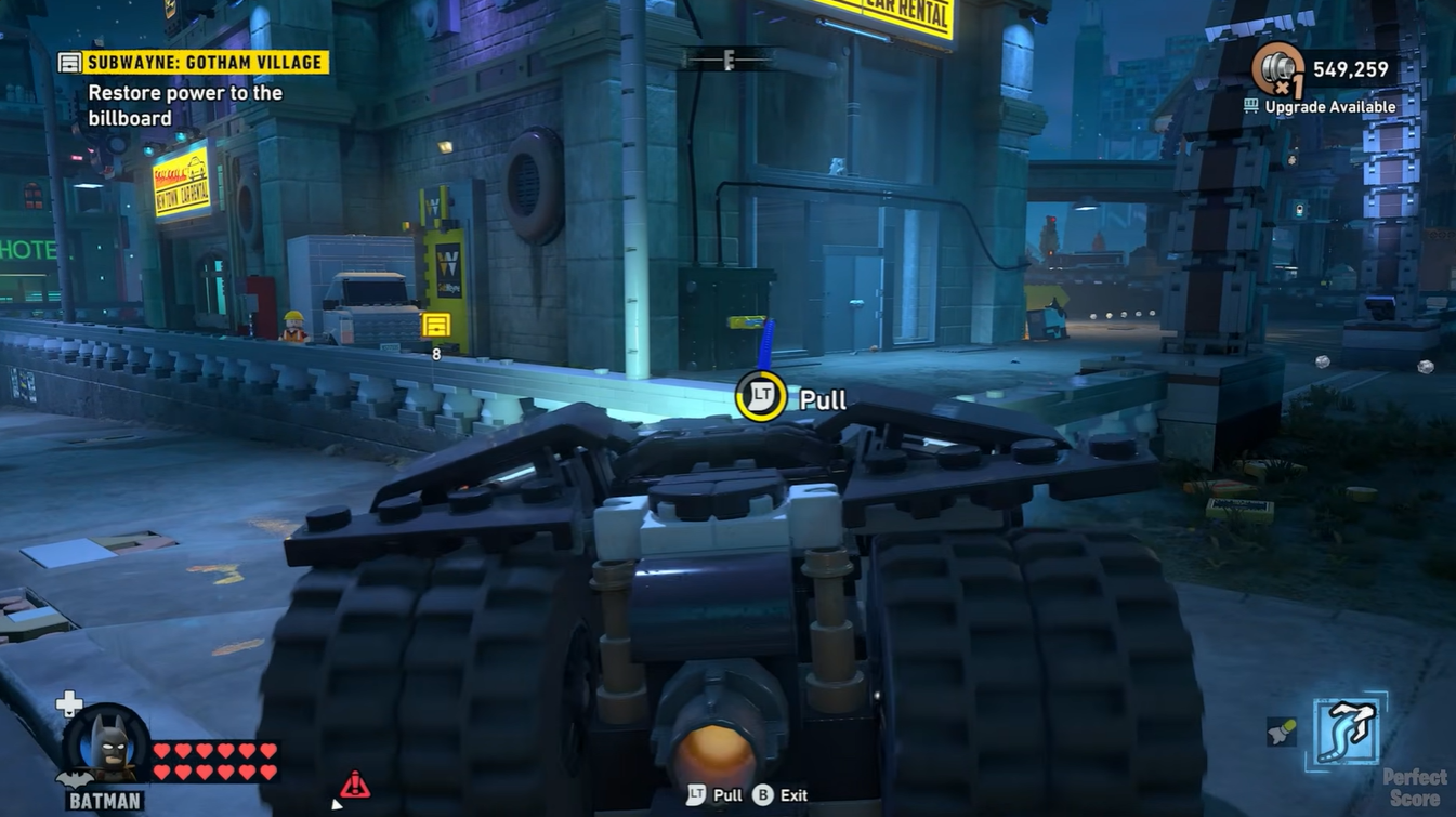 LEGO Batman activating the first construction button in front of the Robinson Park subway station building.