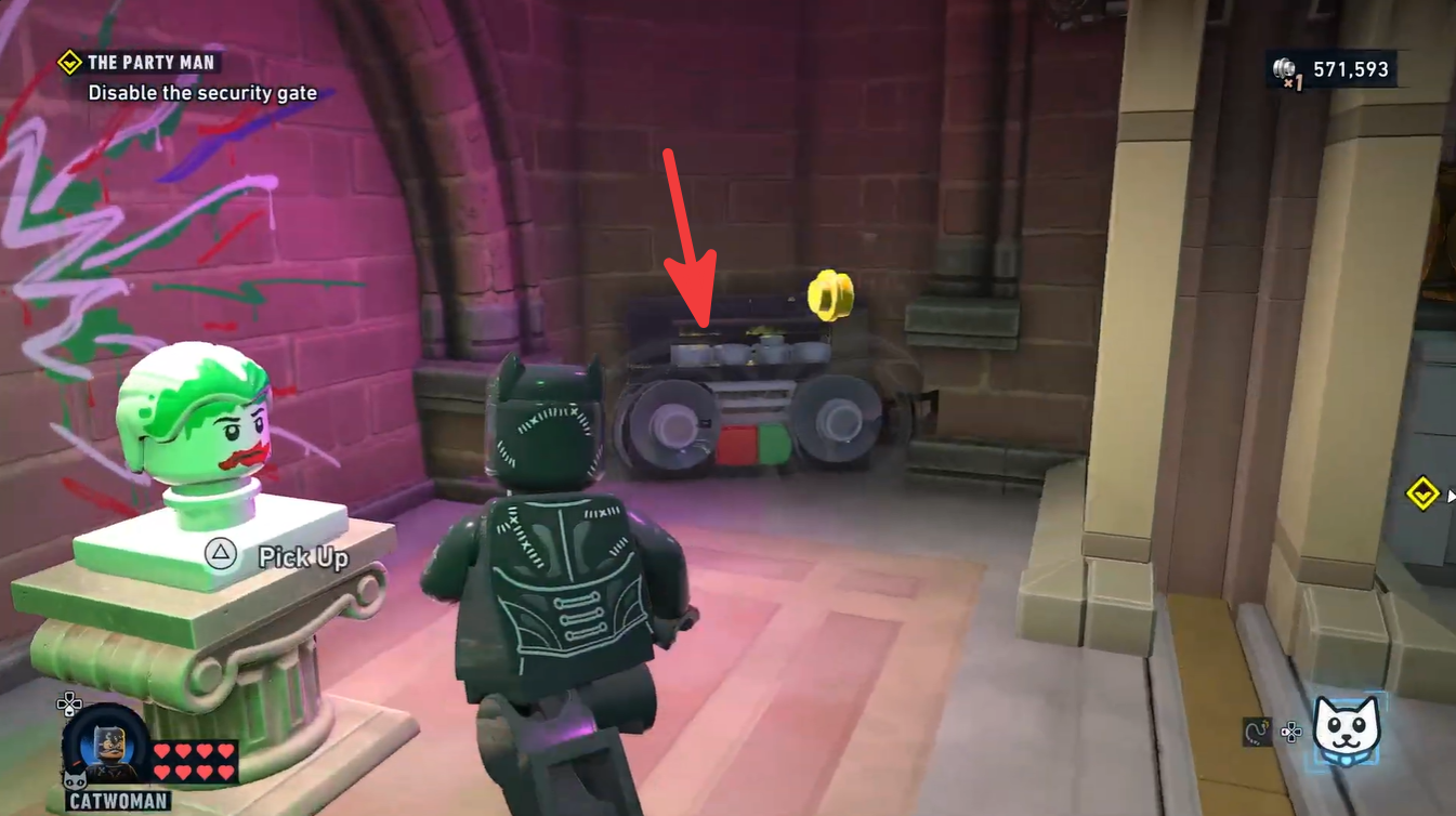 Fourth boombox collectible beside the Joker head after solving the cat puzzle in LEGO Batman.