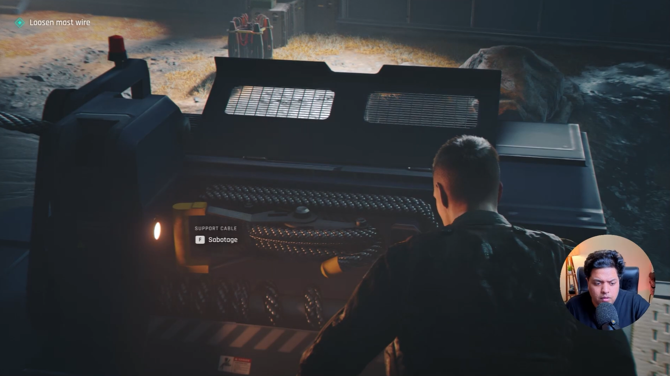Support cable sabotage interaction prompt displayed as Bond prepares to loosen the mast wire on the rooftop in 007 First Light.