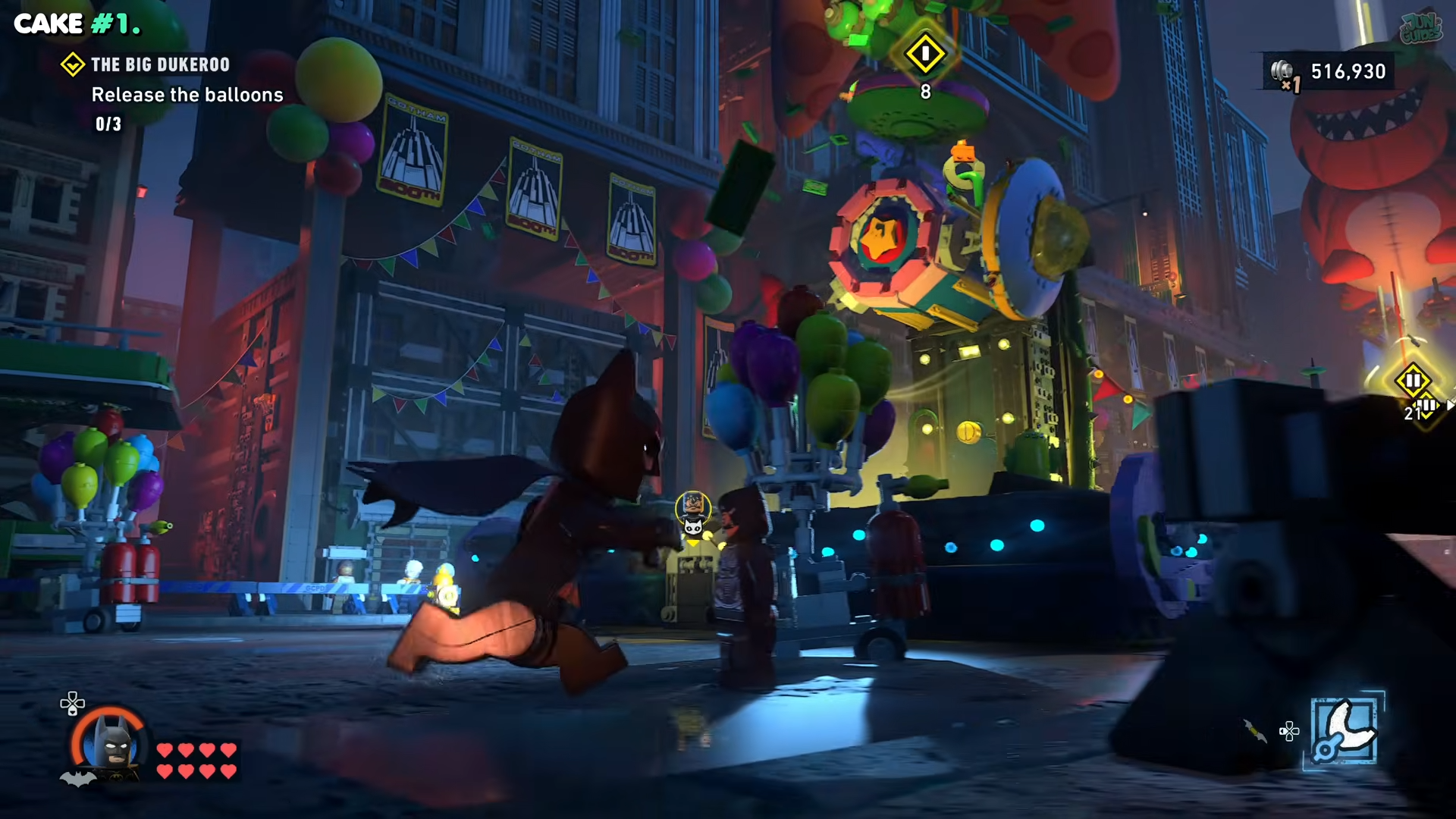 Batman walking past the first balloon in the Bug Dukeroo in Lego Batman: Legacy of the Dark Knight