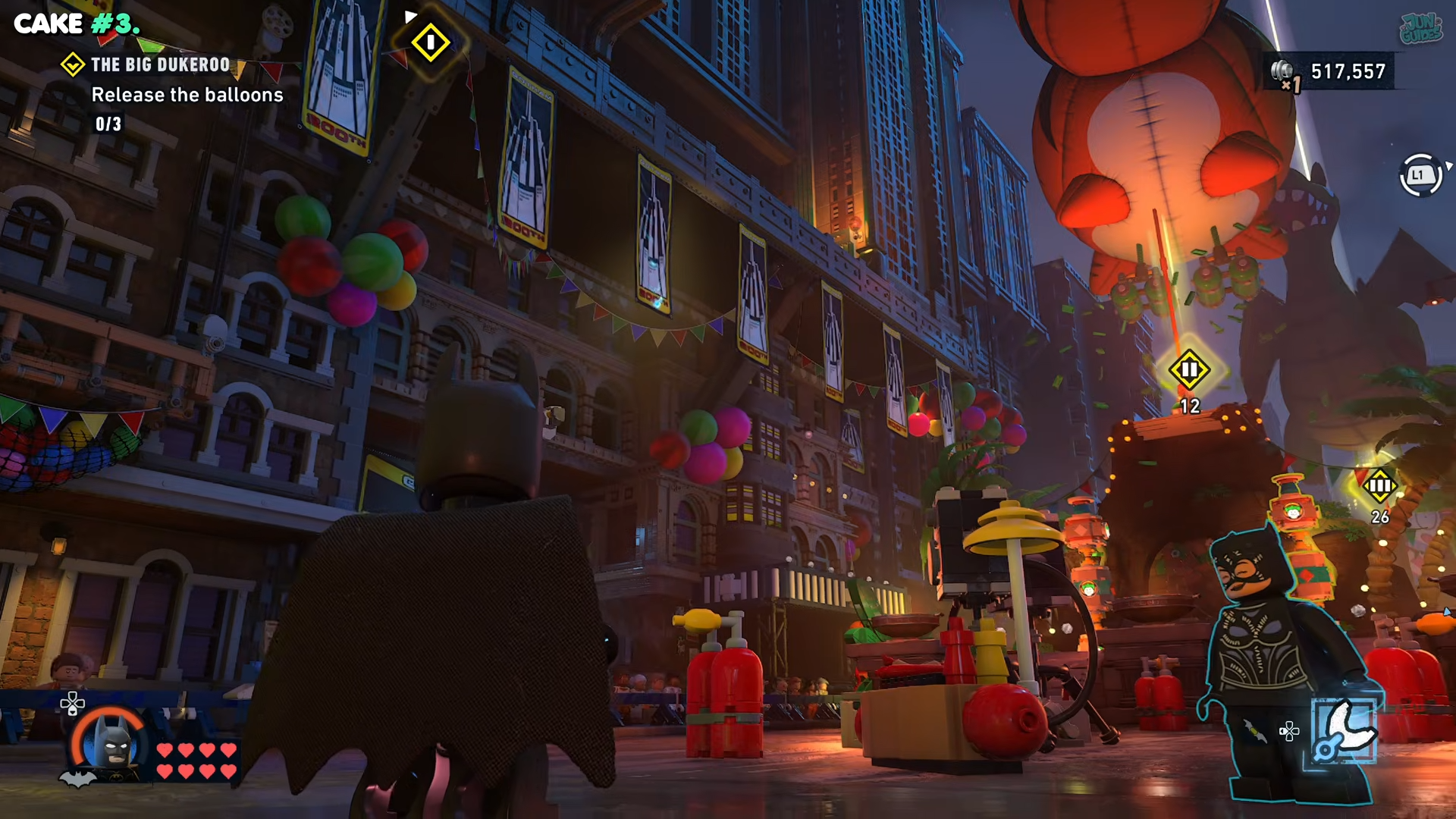 Batman walking past the second balloon in the Big Dukeroo in Lego Batman: Legacy of the Dark Knight