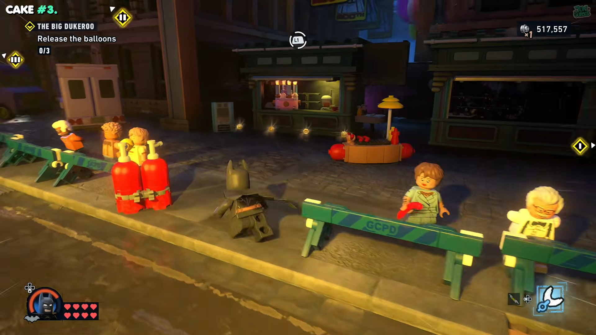 Batman walking on the sidepath and looking at a sideshop with a cake in Lego Batman: Legacy of the Dark Knight