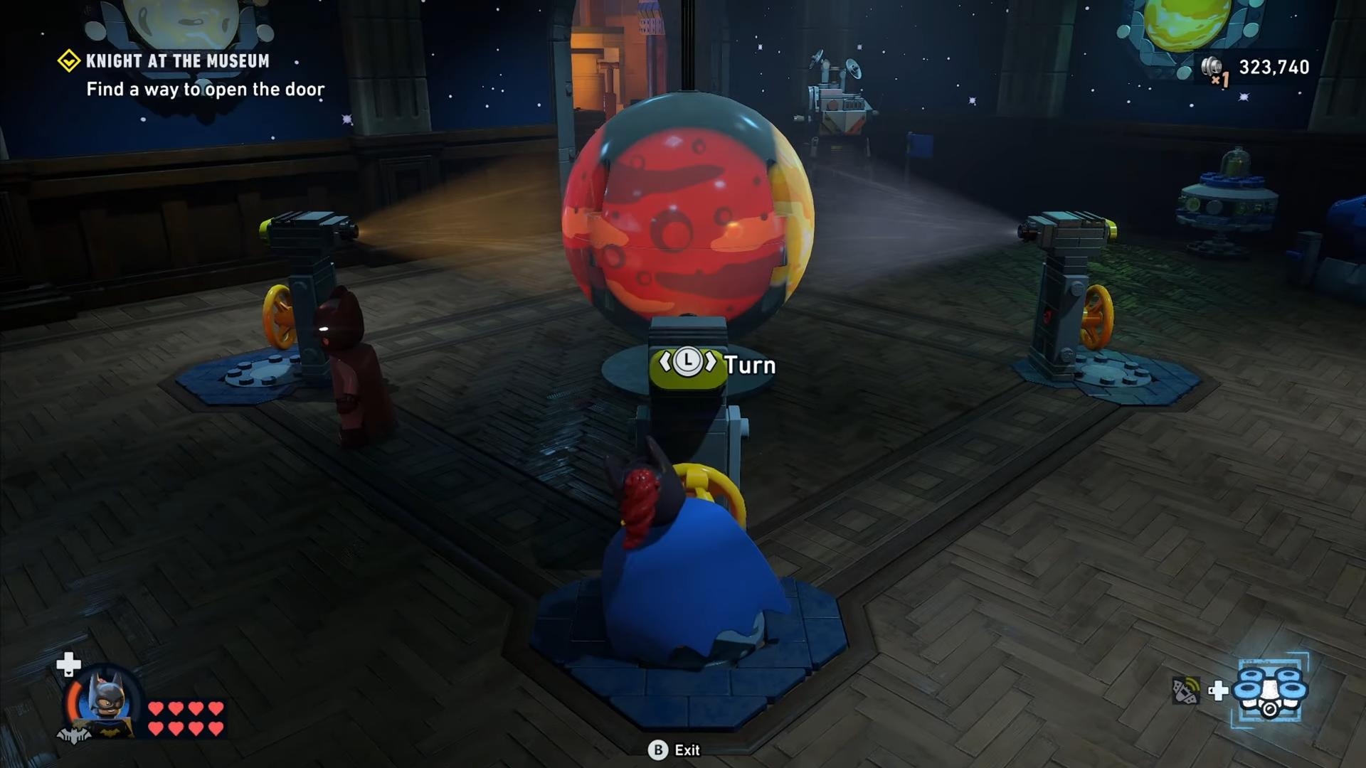 Character turns the mechanism on all planets until they are all red in Knight at the Museum mission in Lego Batman: Legacy of the Dark Knight.