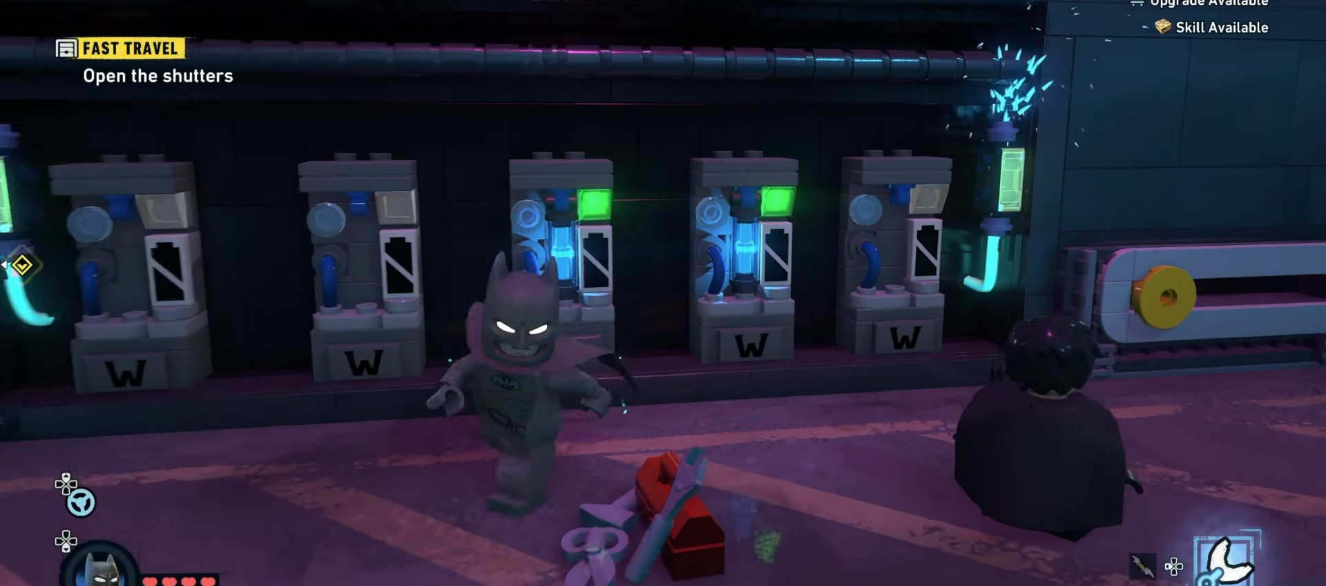 Batman plugging in the second battery to the left of the first battery in the battery system in Newtown in Lego Batman Legacy Of The Dark Knight
