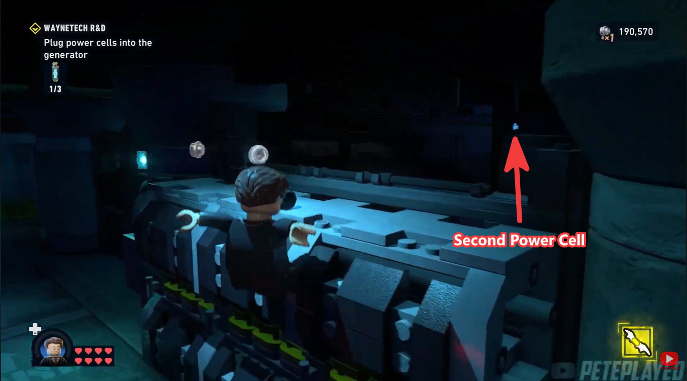 Batman collecting the second Power Cell from the elevated WayneTech platform in LEGO Batman: Legacy of the Dark Knight