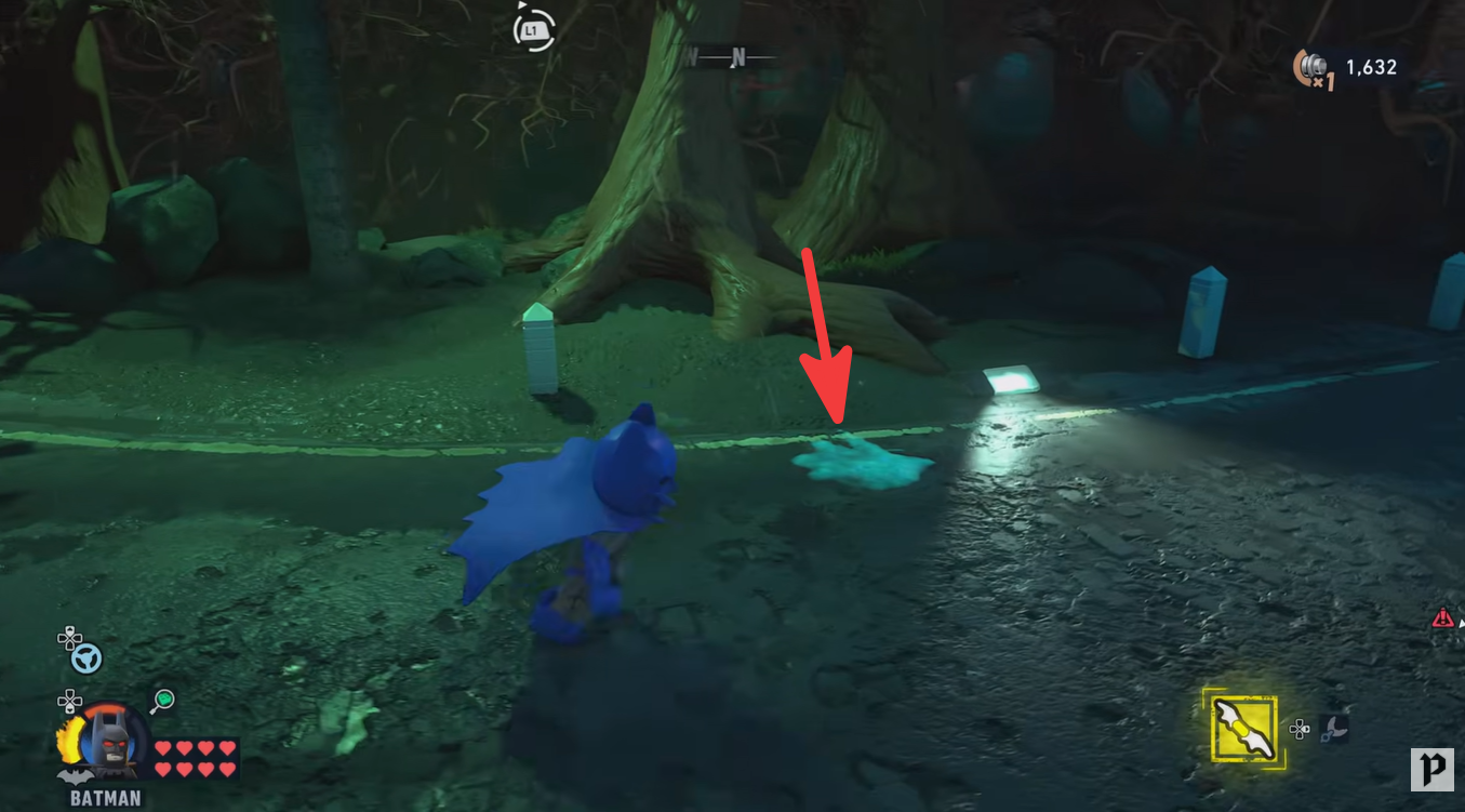 Close-up of the green ectoplasm puddle hidden beside the road near Arkham Asylum in LEGO Batman Legacy of the Dark Knight