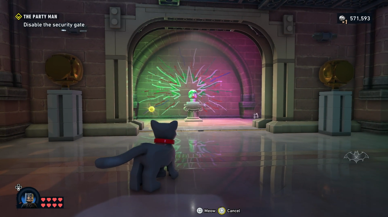 Fourth boombox collectible beside the Joker head after solving the cat puzzle in LEGO Batman.