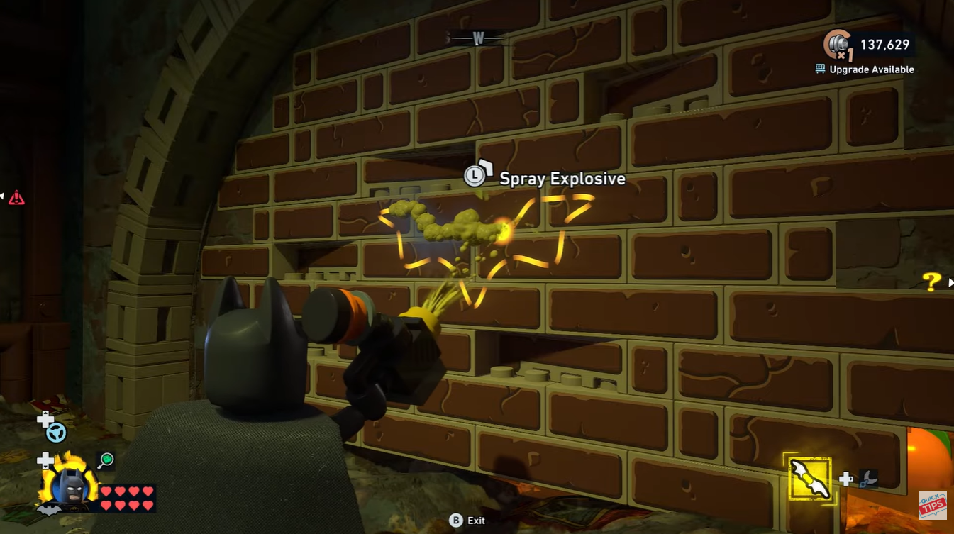 Break the wall by sparying explosive in LEGO Batman Legacy of the Dark Knight