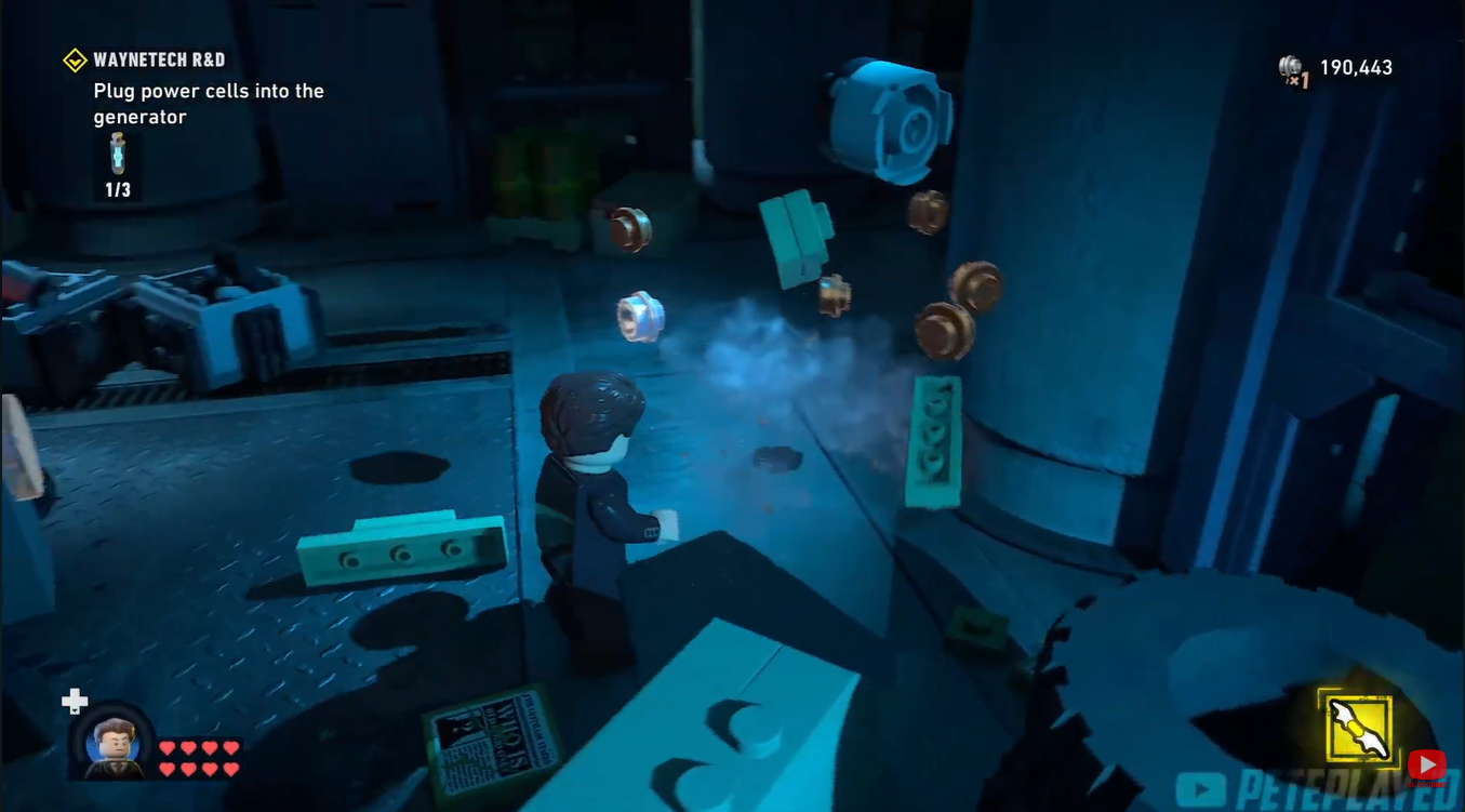 LEGO pieces scattered after destroying boxes near the third Power Cell location in LEGO Batman: Legacy of the Dark Knight