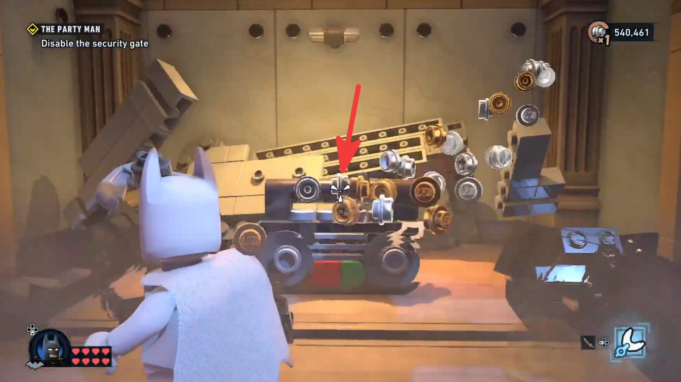 Batman breaking a cabinet on the left side of the Party Man mission to reveal the third boombox collectible.