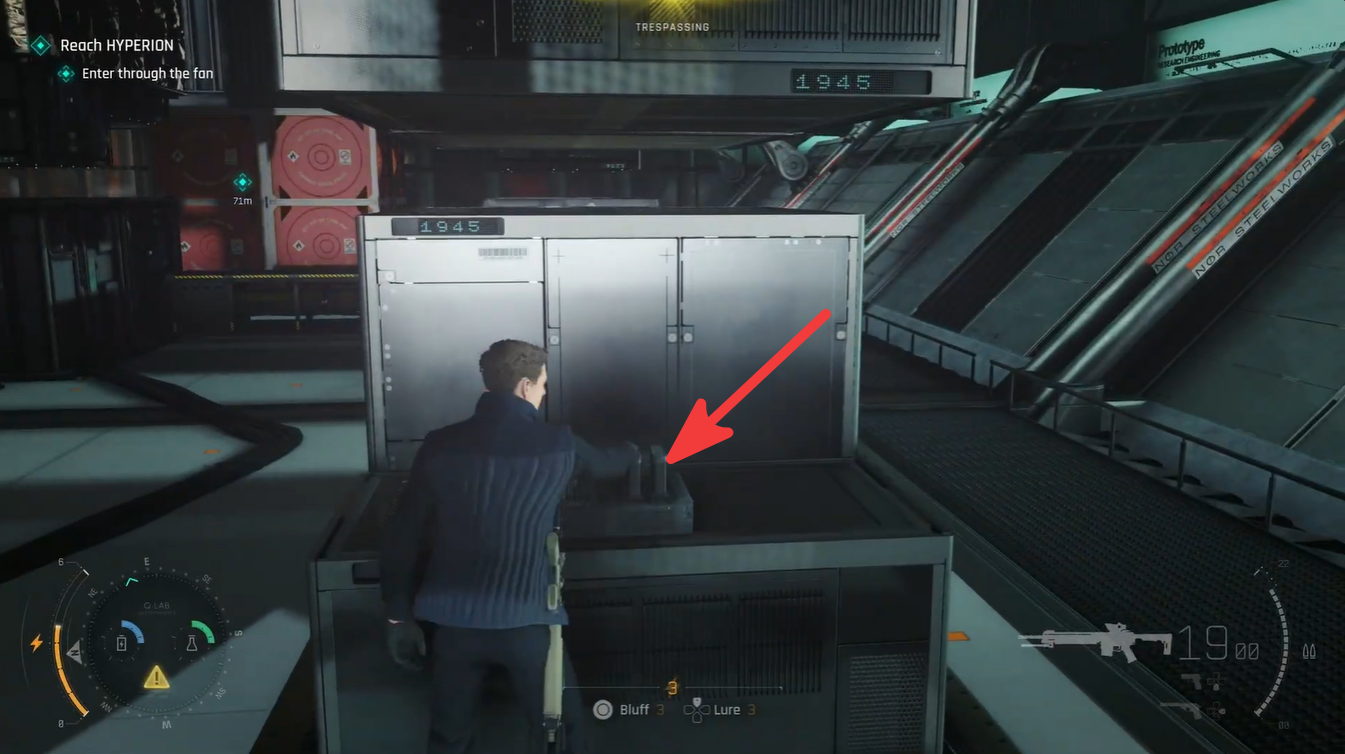 A rechargeable battery station located beside a server cabinet provides power for Bond's watch, helping maintain gadget functionality during the metallic sphere puzzle.