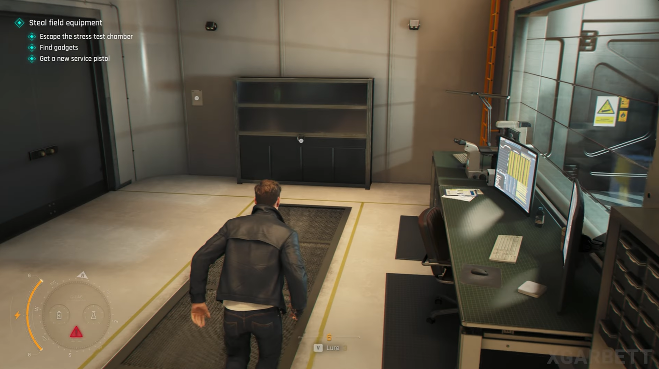 Location of the Q-03 Stress Testing Cabinet inside the Q-Lab, highlighted with a red arrow near the workstation area.