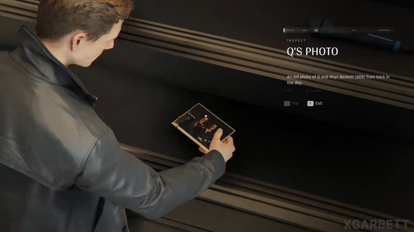 James Bond inspecting an old photograph of Q and Rhys Beckett (009) inside the Q-Lab in 007 First Light Chapter 15.