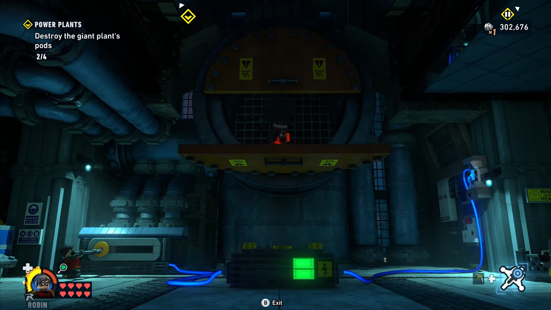 Batman drops down to the platform opened by Robin in Power Plants mission in Lego Batman: Legacy of the Dark Knight.