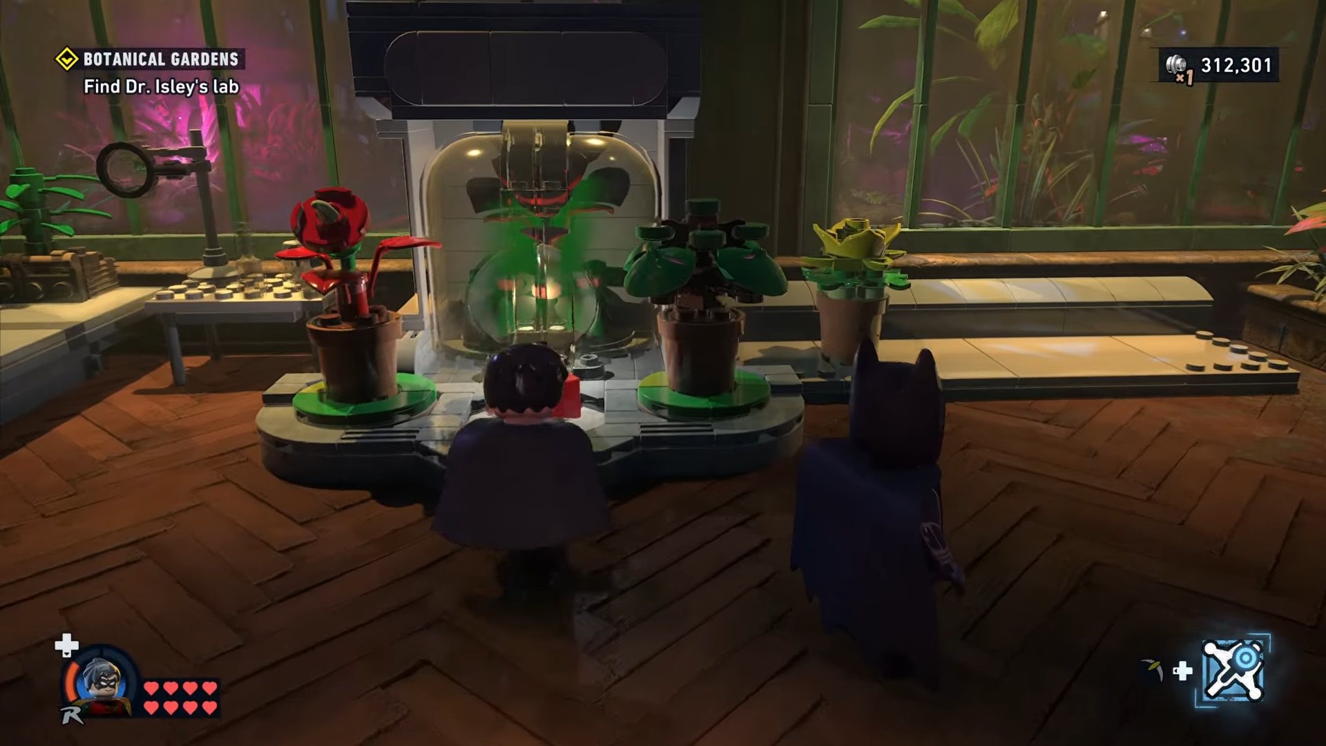 Robin grabbing the red brick in Botanical Gardens in Lego Batman: Legacy of the Dark Knight.
