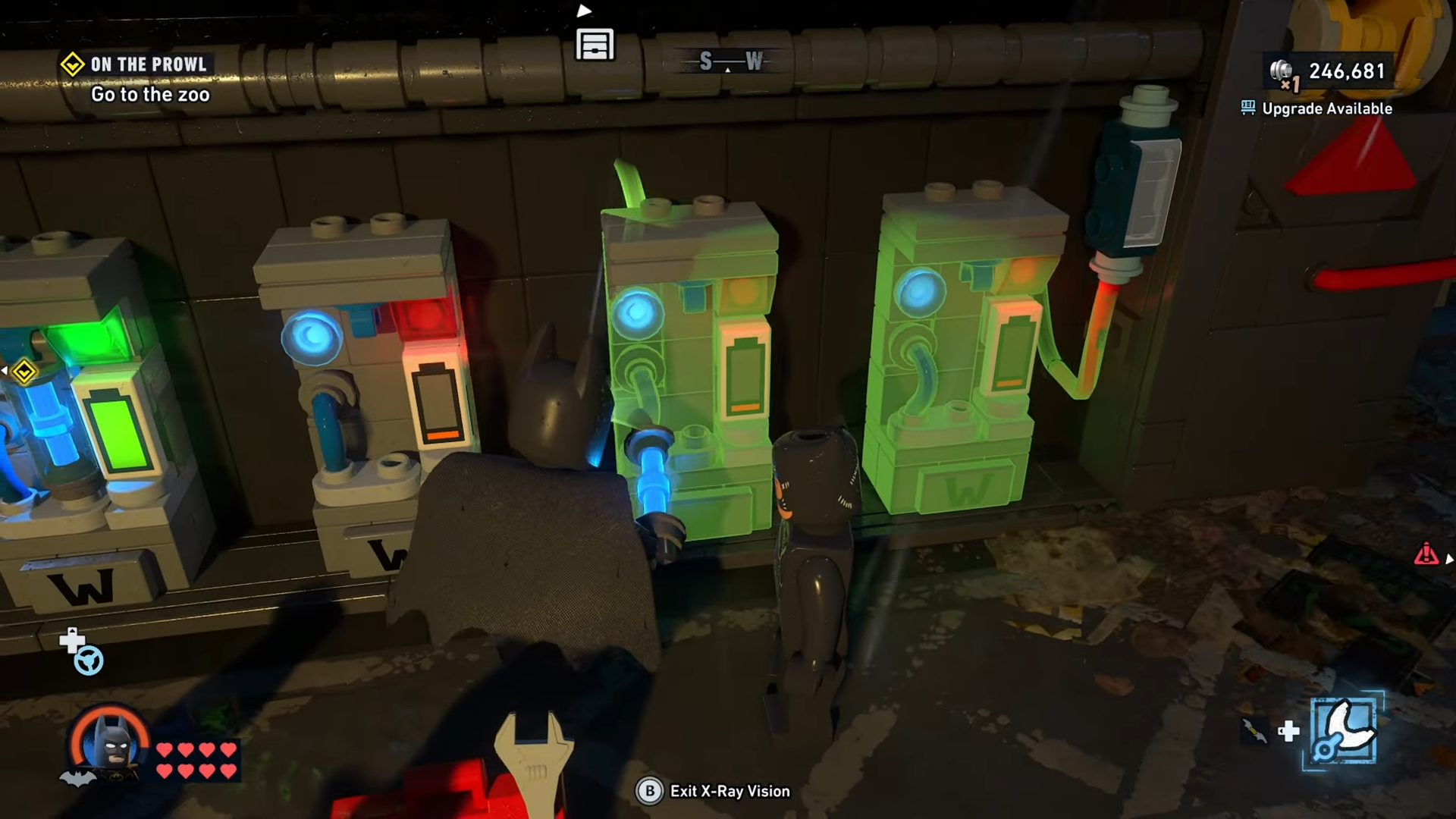 Batman places the battery in the second to right chamber of the machine to open the tunnel to Subwayne Old Gotham South in Lego Batman Legacy of the Dark Knight.