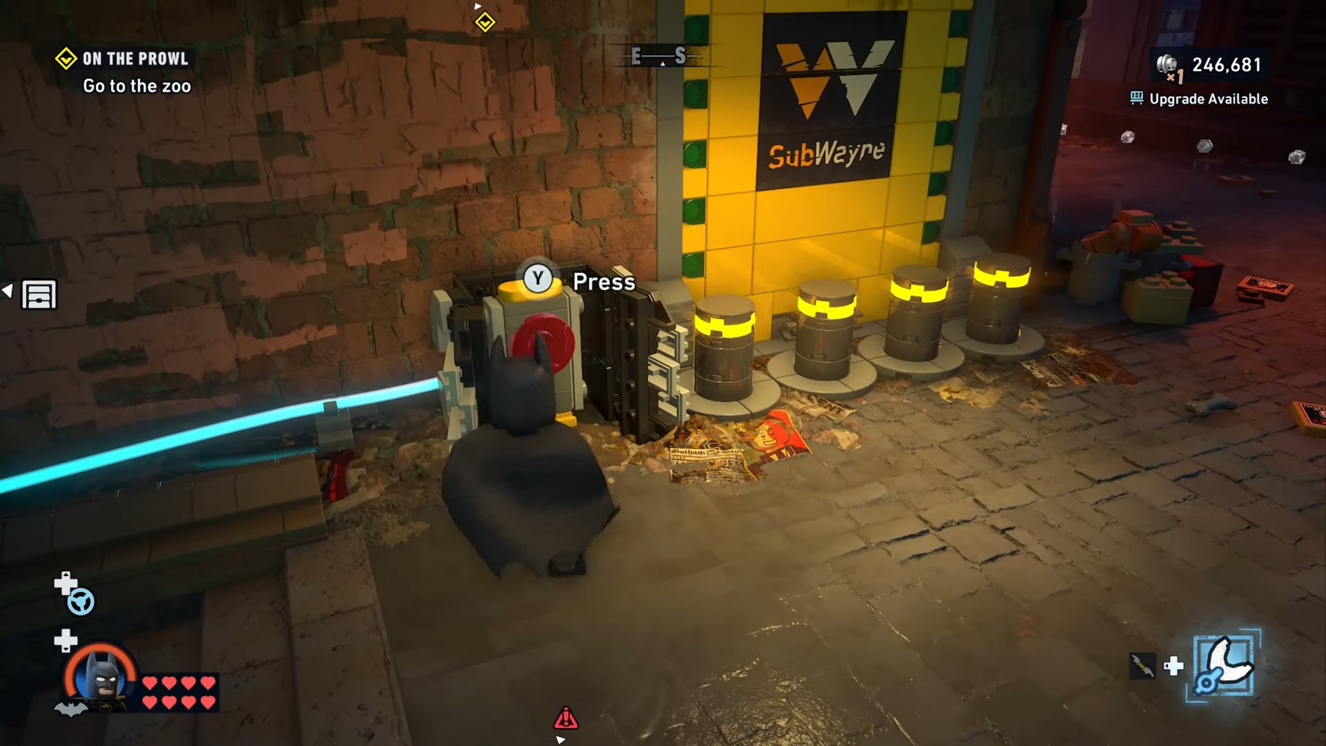 Batman presses the button to open the tunnel to Subwayne Old Gotham South in Lego Batman Legacy of the Dark Knight.