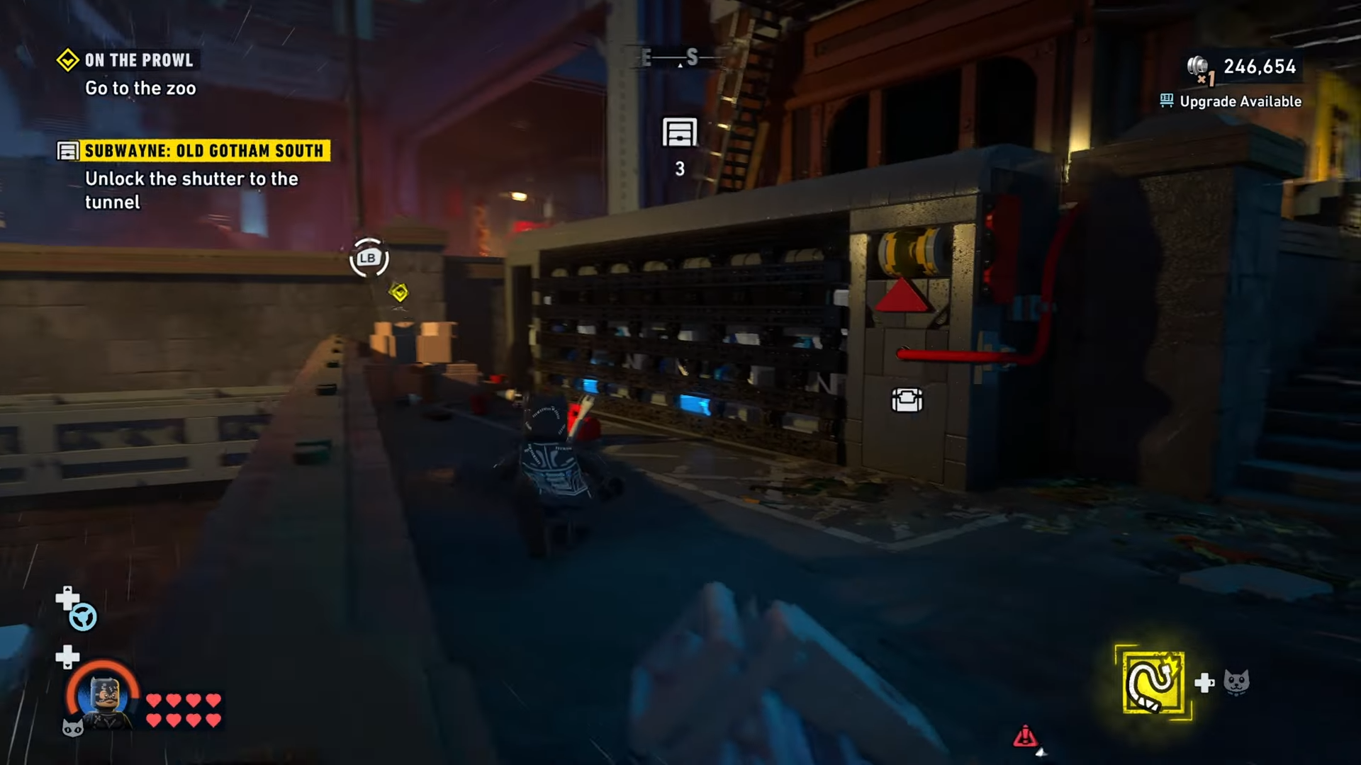 Catwoman stands before the machine that opens the tunnel to the Subwayne Old Gotham South in LEGO Batman Legacy of the Dark Knight