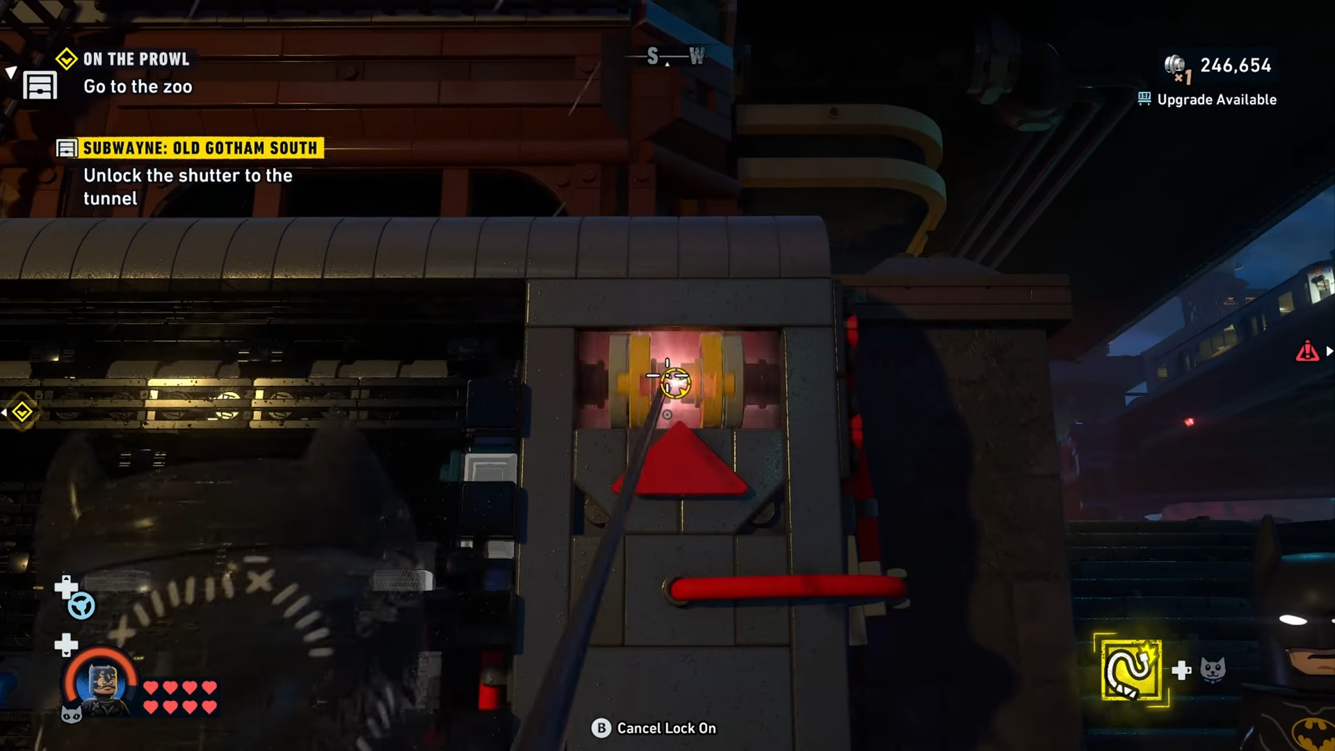 Catwoman uses her whip on the mechanism of the machine for the opening of the tunnel at Subwayne Old Gotham South in Lego Batman Legacy of the Dark Knight.