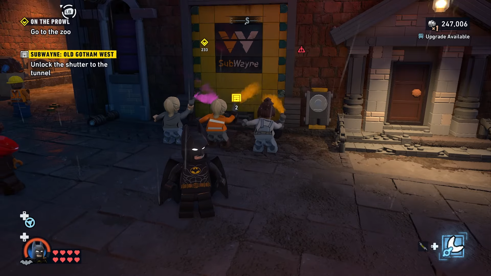 Graffiti artists painting the Subwayne wall and blocking access in Old Gotham West in Lego Batman: Legacy of the Dark Knight