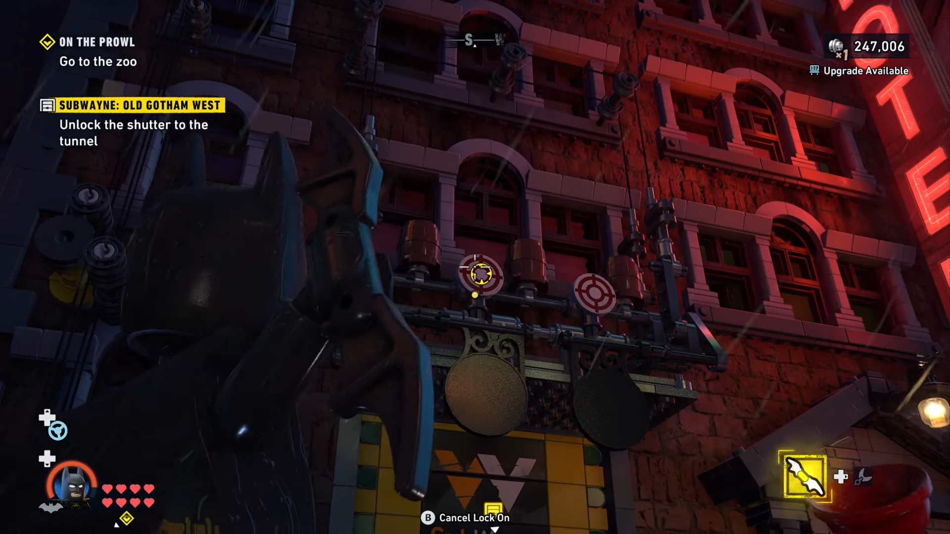Batman aiming at the targets above the Subwayne tunnel shutter in Lego Batman: Legacy of the Dark Knight