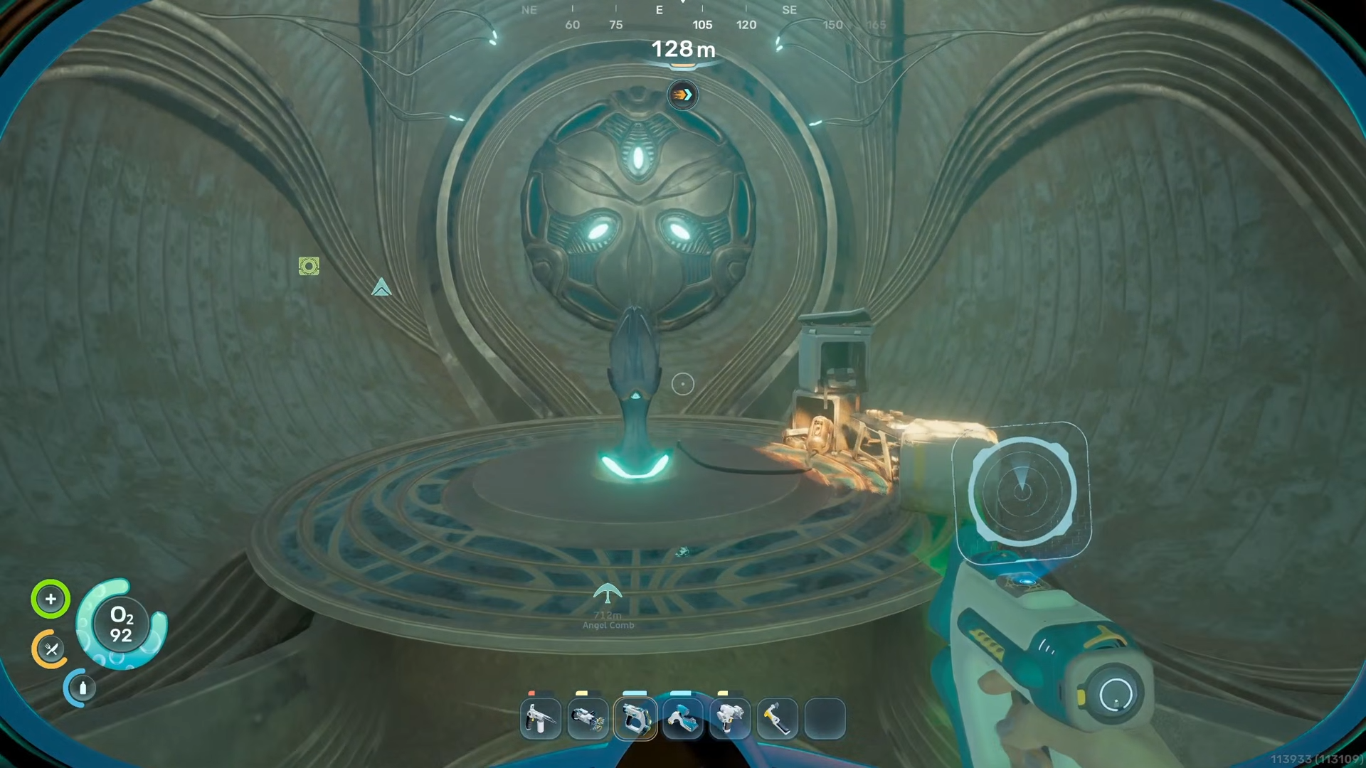 Wide shot of the Axum alien tower rising from the seafloor with its main tunnel entrance visible in Subnautica 2