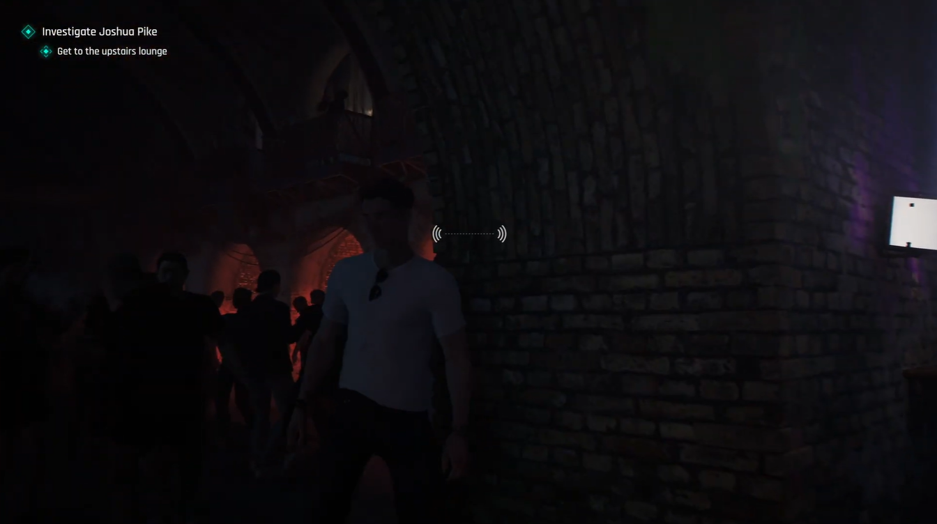 Bond walking through the crowded nightclub bar toward the upstairs lounge staircase in 007 First Light