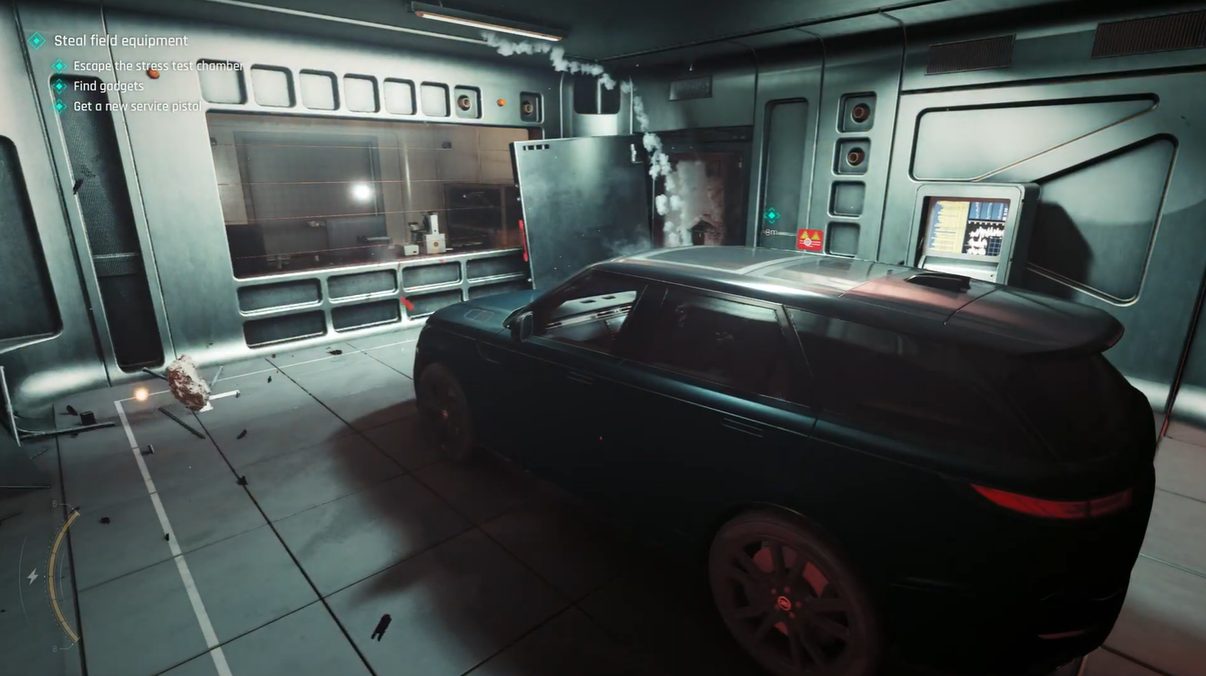 Red emergency lighting illuminating the test chamber as the explosion countdown begins, with Bond seated inside the vehicle waiting for the stress test to complete.