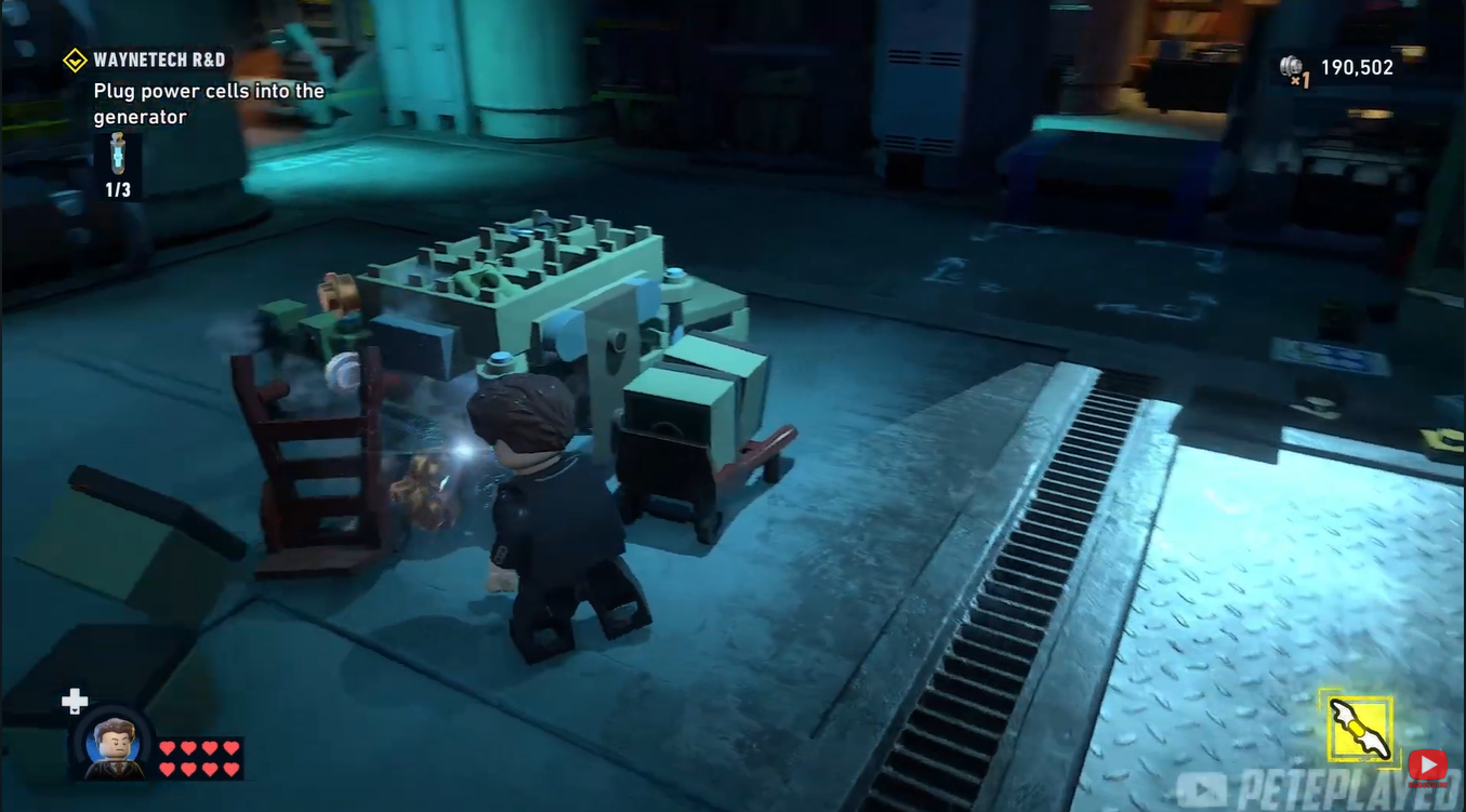 Destroyed storage boxes beside the WayneTech cart puzzle area in LEGO Batman: Legacy of the Dark Knight