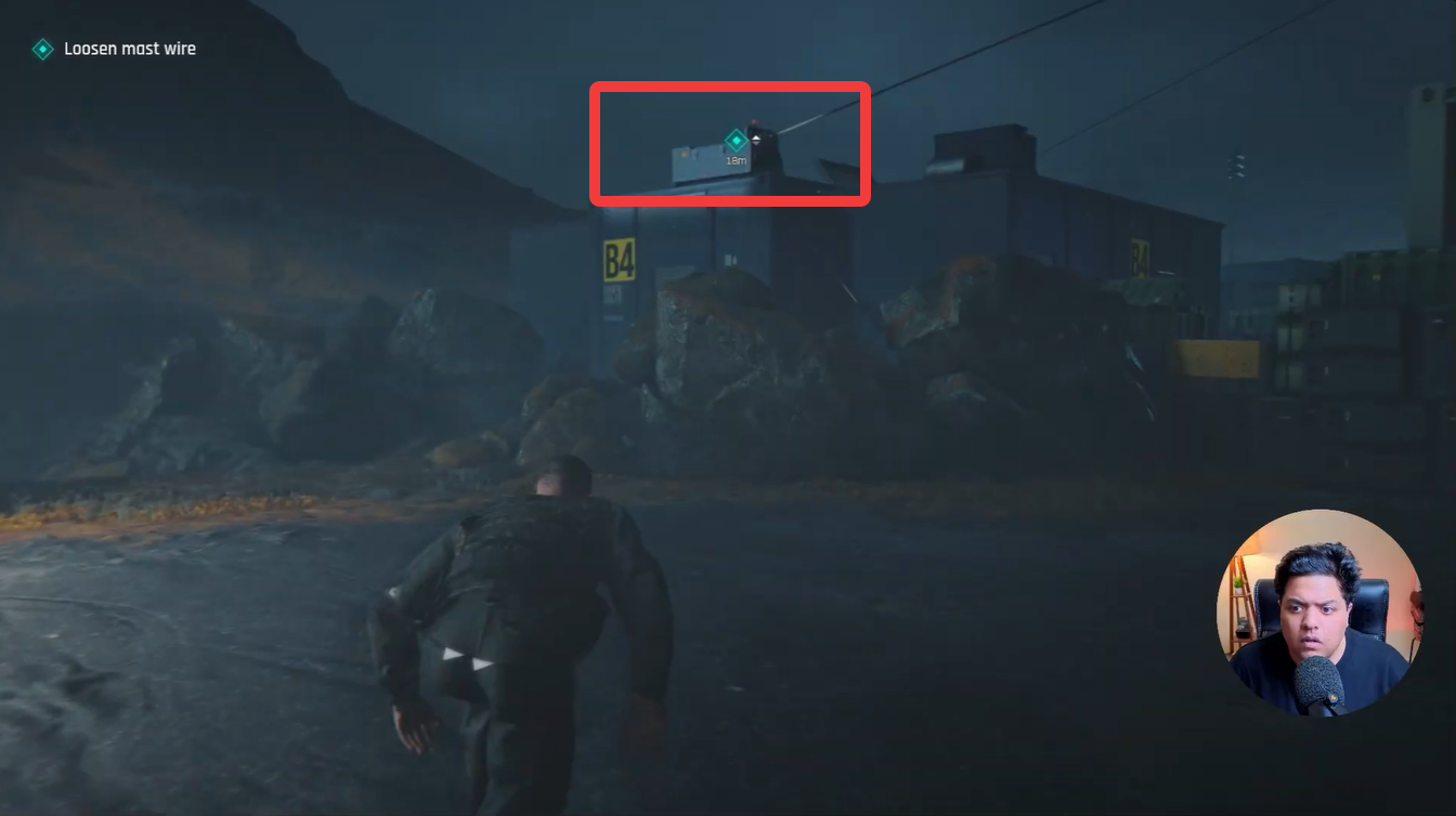 James Bond approaching the mast wire objective marker on top of a container building during the Against The Odds prologue mission in 007 First Light.