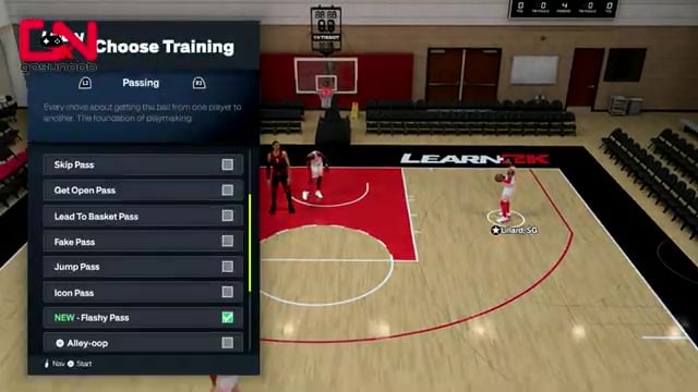 Player behind-the-back passes to a teammate near the basket