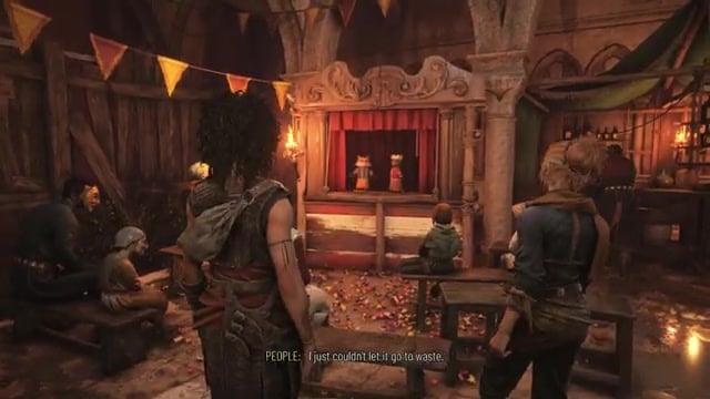 Head behind the fire-juggler stage