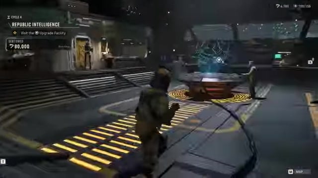 Walk to the console in the back-right