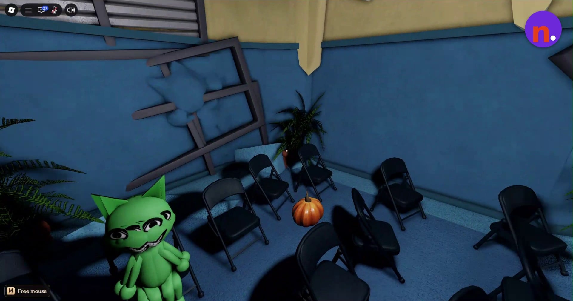 Find the orange pumpkin on the carpet among the black folding chairs