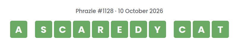 Phrazle answer for puzzle #1128 shown as green tiles: A SCAREDY CAT.