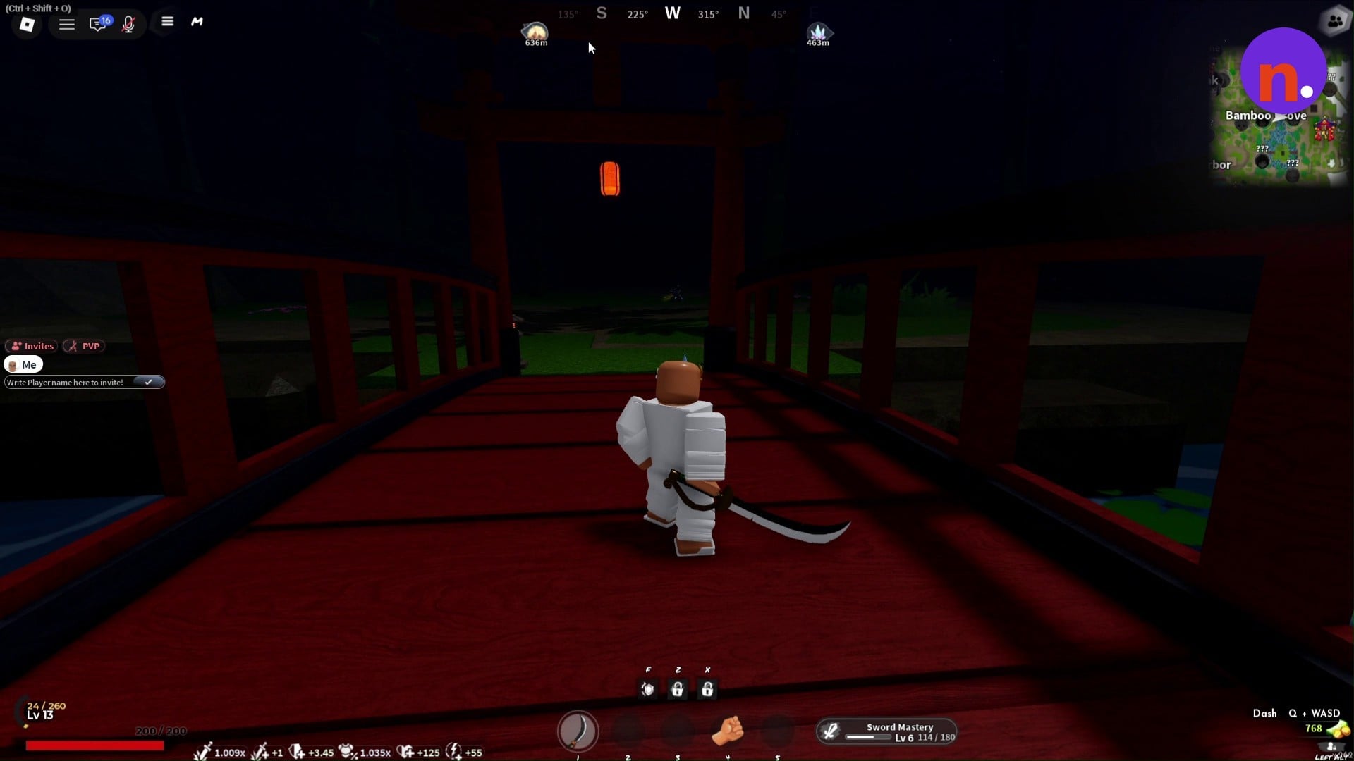A red wooden bridge leads toward a torii gate